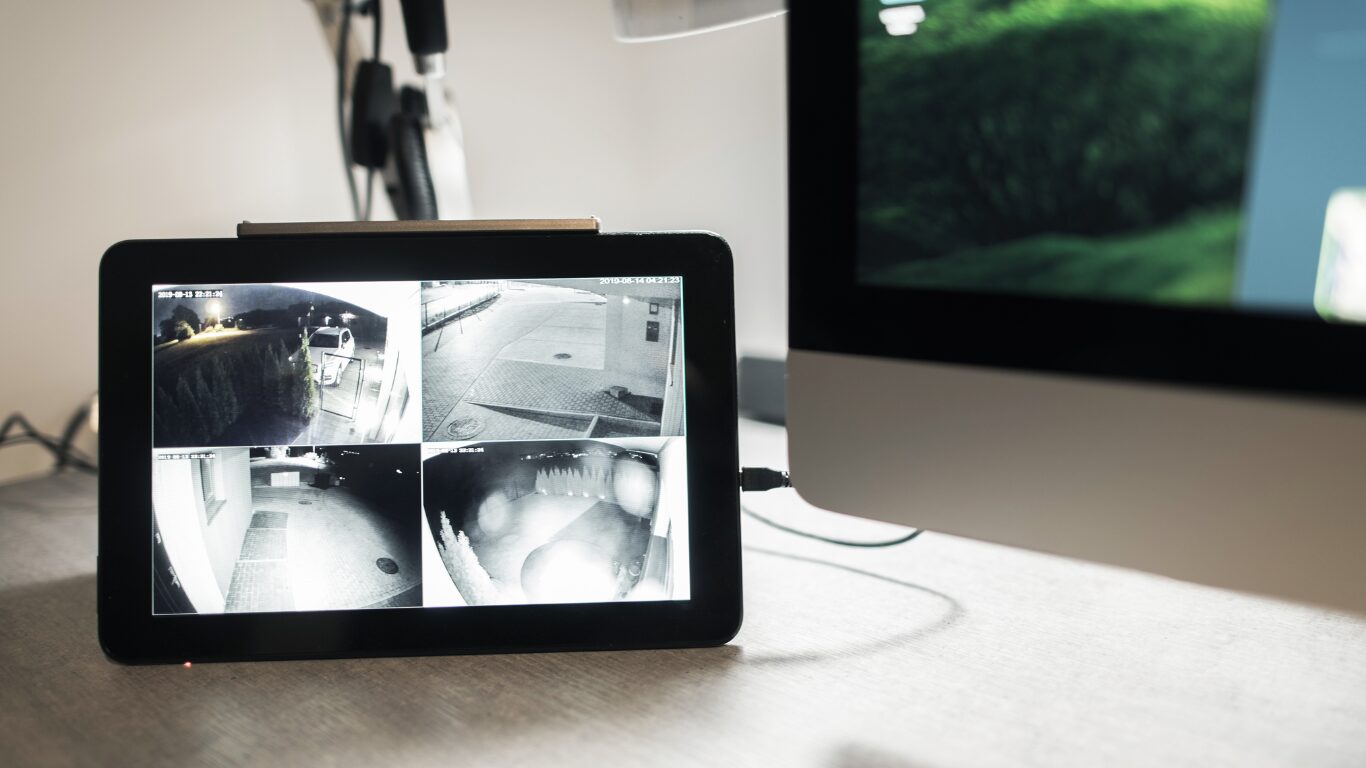 Night Vision Technology for Home Security, Camera Feed on tablet sitting on home desk.