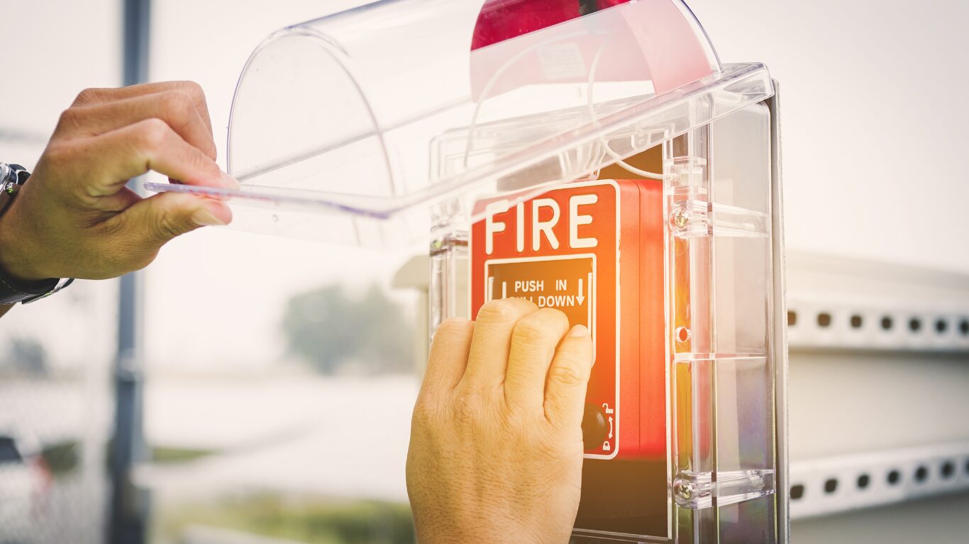 Fire Alarm Panel Being activated By Person, Keeping Everyone Safety & adhering to Regulations