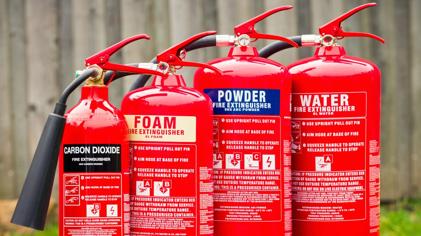 Different fire extinguisher types: CO2, FOAM, Dry Powder, Water fire extinguishers. 